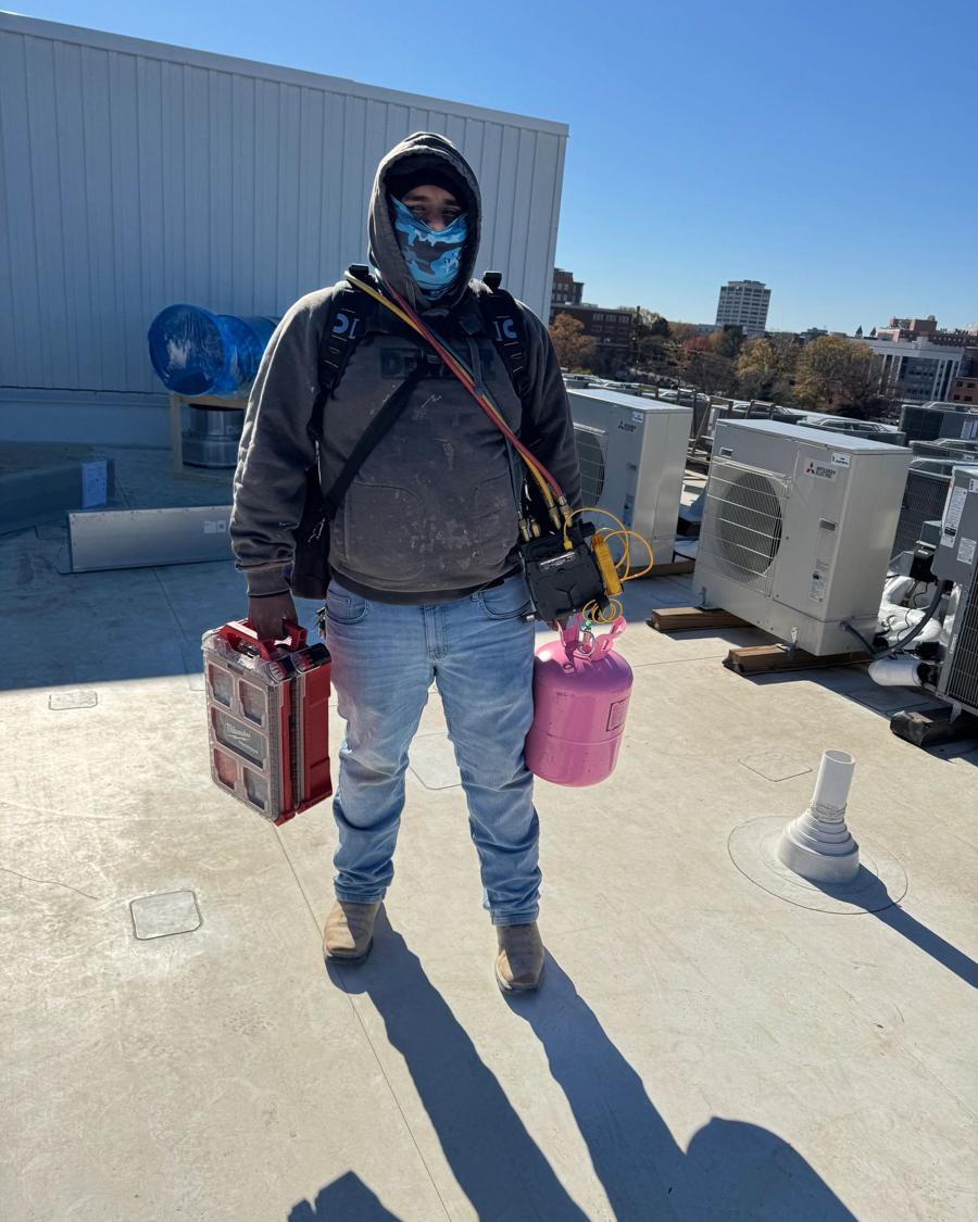 Technician on a rooftop job site
