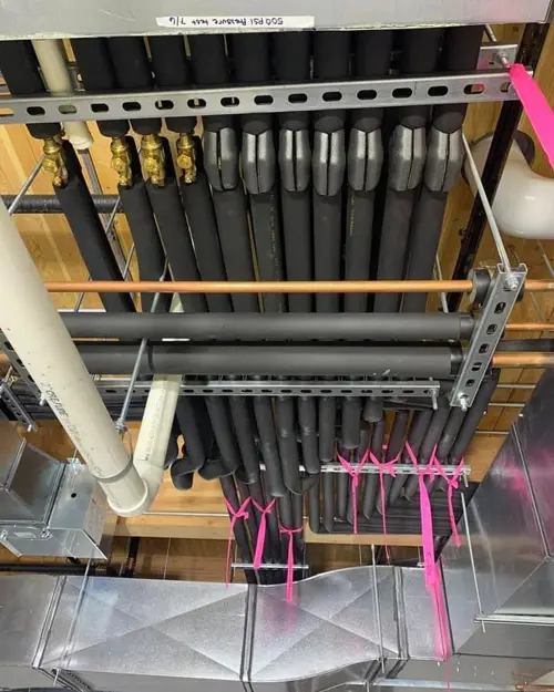 Insulated line sets running along a ceiling